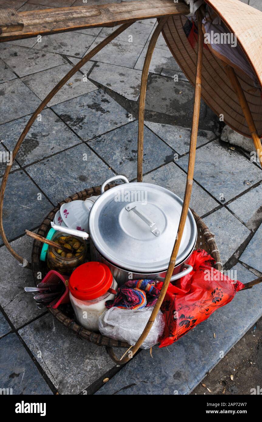 Traditional Vietnamese metal kitchen utensils for preparing and serving