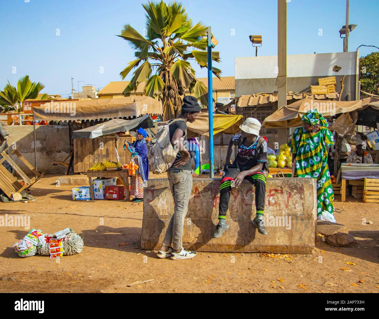 MBour, Senegal, AFRICA - April 22, 2019: Street fruit market where locals sell tropical fruits like melons, mangoes, oranges, lemons and more. A group Stock Photo