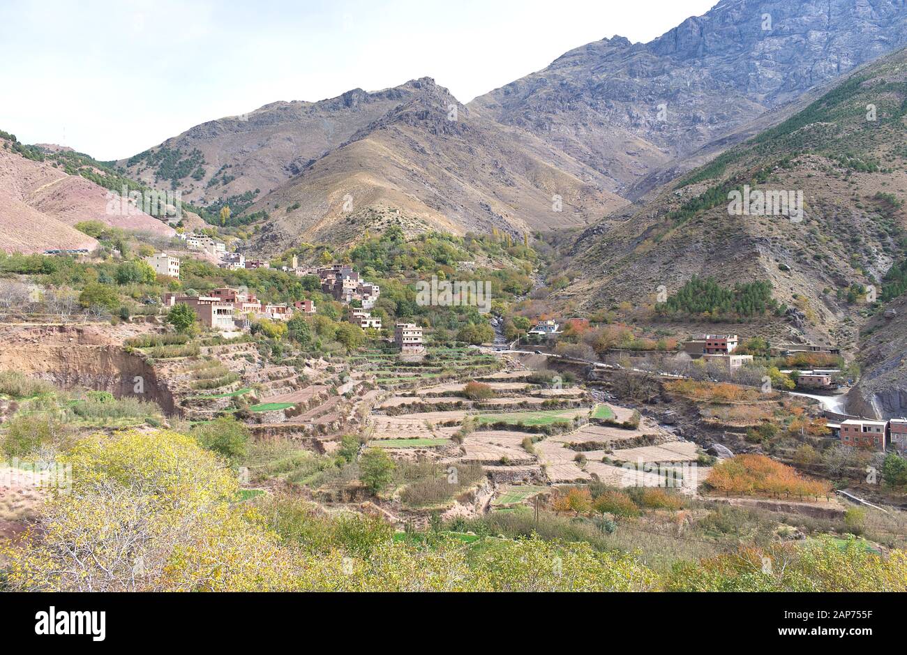 View of the village of Tamatert in the Moroccan Atlas Mountains which lies in the valley close to the mountain of Toubkal, with tiered field terraces Stock Photo