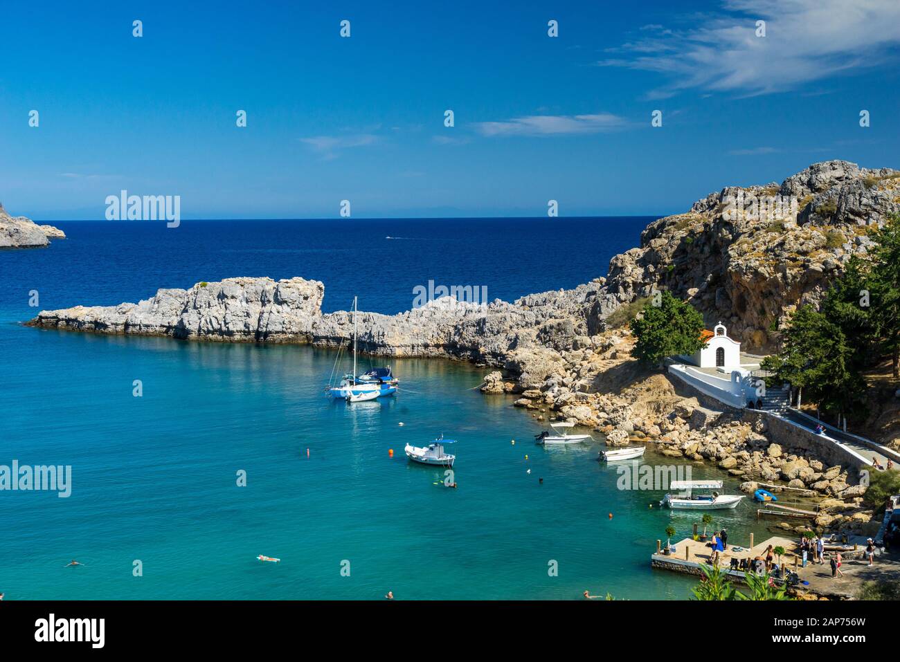 Overlooking the stunning St Pauls Bay Lindos Rhodes Island Greece ...