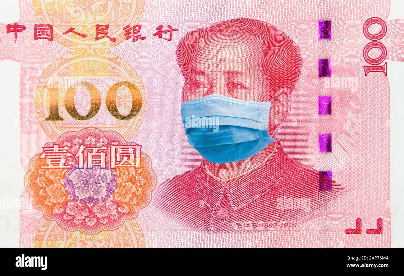 Coronavirus Money and finance. Concept: Quarantine in China, 100 Yuan banknote with face mask. Economy and financial markets affected by corona virus Stock Photo