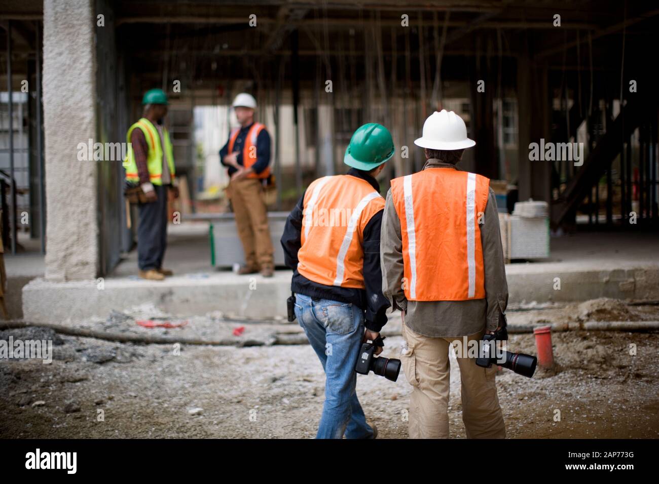 Workers at a construction site with cameras Stock Photo Alamy