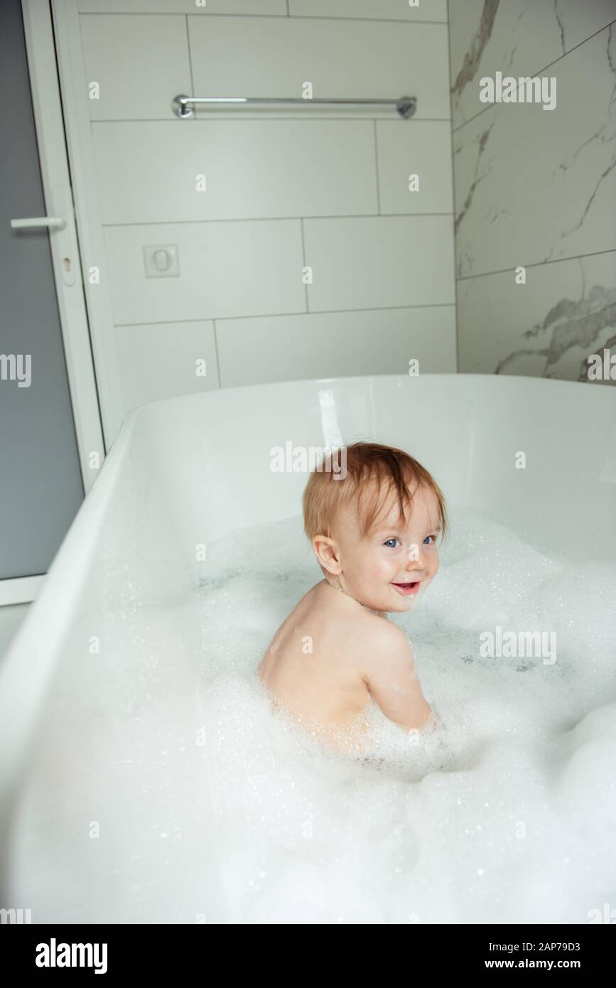 little boy bathing in the foam bath Stock Photo