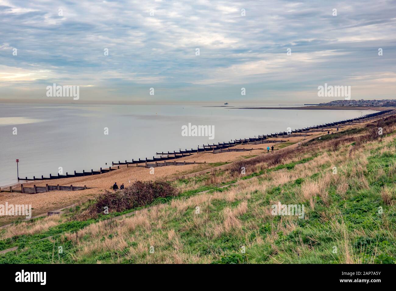Tankerton Bay,and,Slopes,Saxon Shore Way,Herne Bay in the distance,Winter,Calm Sea Stock Photo