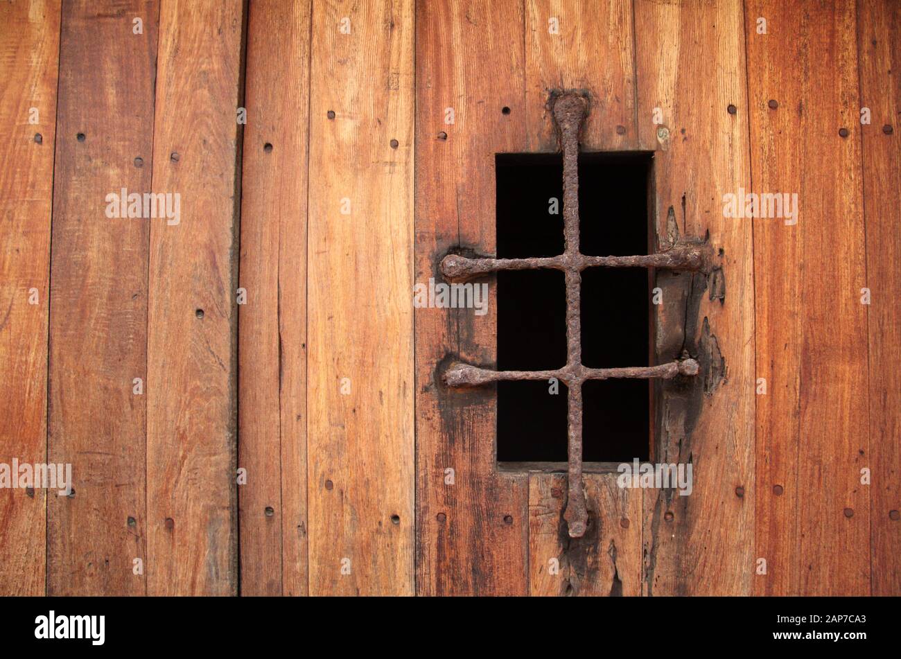 An old wooden door leads to one of the numerous casements inside the formidable El Morro fortress, located in the city of San Juan, Puerto Rico Stock Photo
