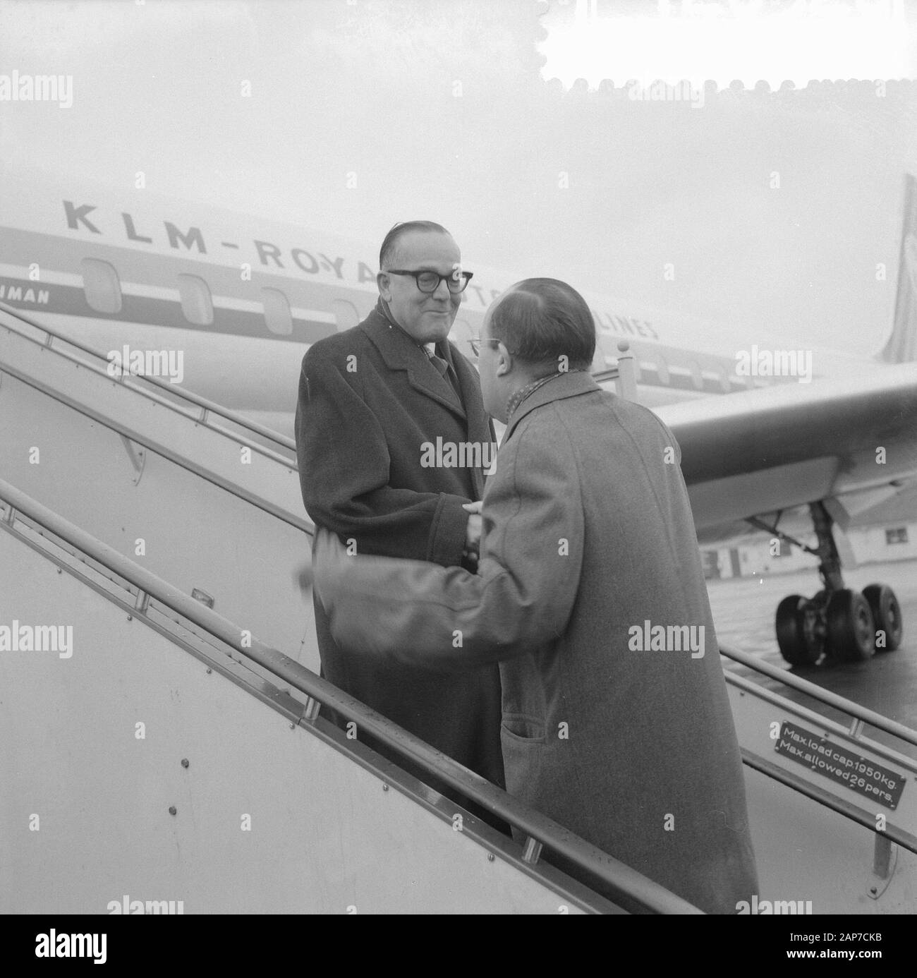 Arrival at Schiphol of Minister of Suriname and the Netherlands Antilles, Minister Cals greets Minister Mr. J. C. Debrot of the Netherlands Antilles Date: 29 January 1961 Location: Amsterdam, Noord-Holland Keywords: Arrivals, Ministers Personal Name: Cals, Jo, Minister Mr. J. C. Debrot Stock Photo