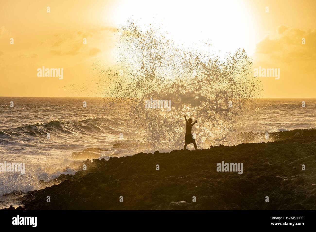 Waves crashing into shoreline rocks, Blwholes, Grand Cayman Stock Photo