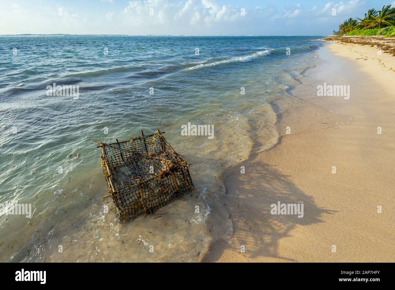 Lobster trap washed ashore Stock Photo