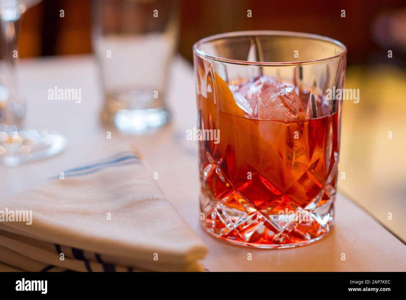 A fresh Negroni poured over ice with an orange twist Stock Photo