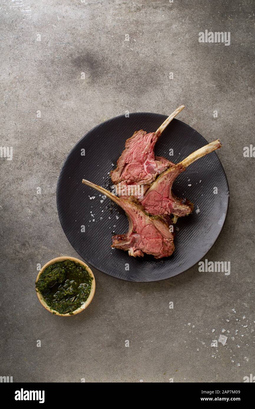 Roasted rack of lamb with spicy rosemary sauce Stock Photo - Alamy