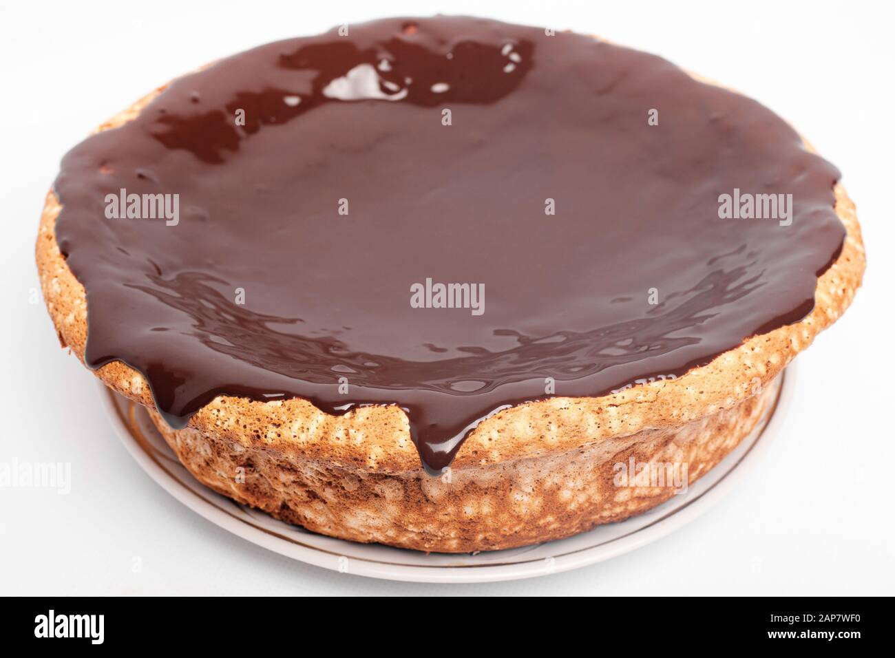 flowing chocolate pie. sponge cake with hot chocolate. Stock Photo