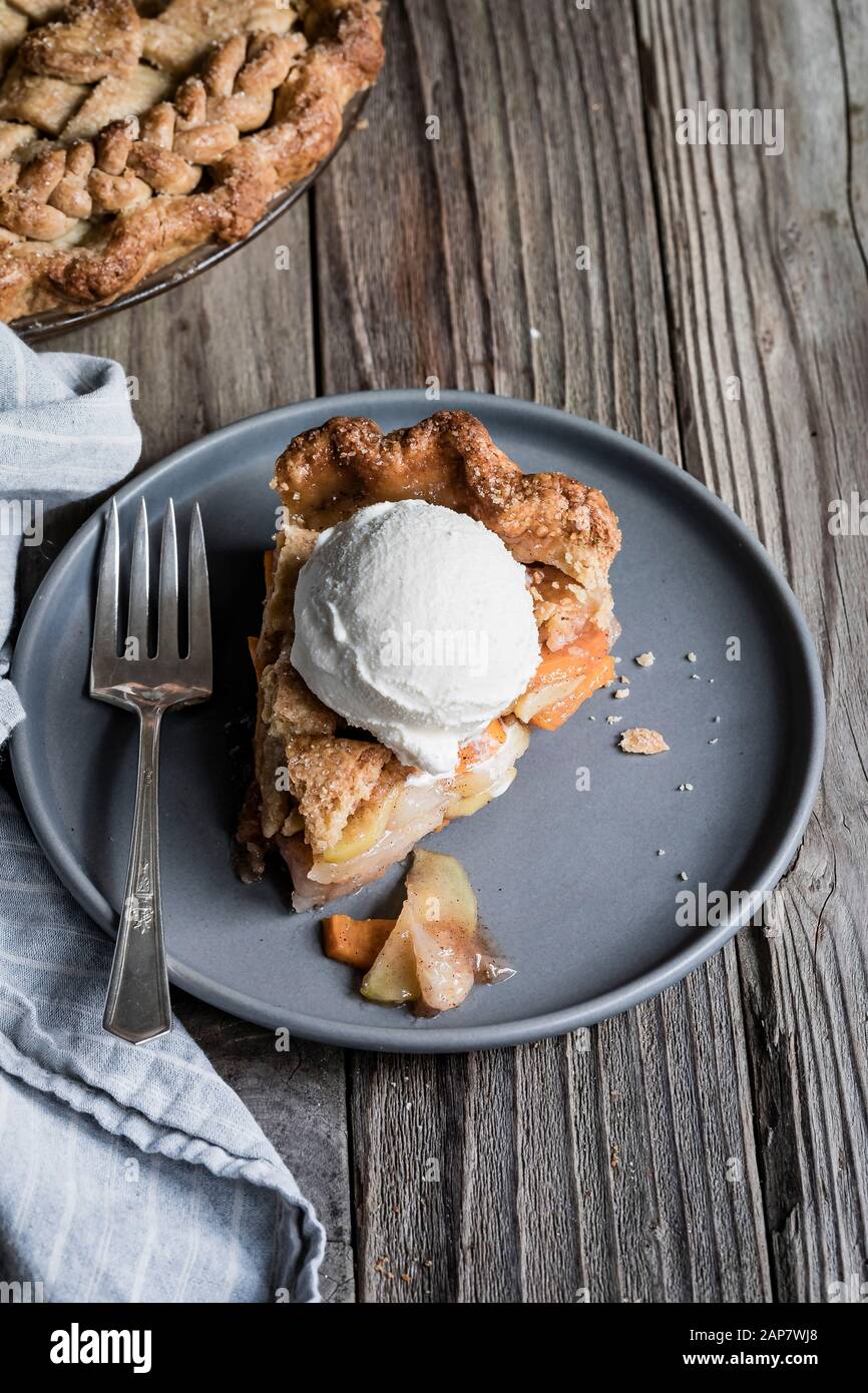 Vanilla bean, pear and persimmon pie Stock Photo