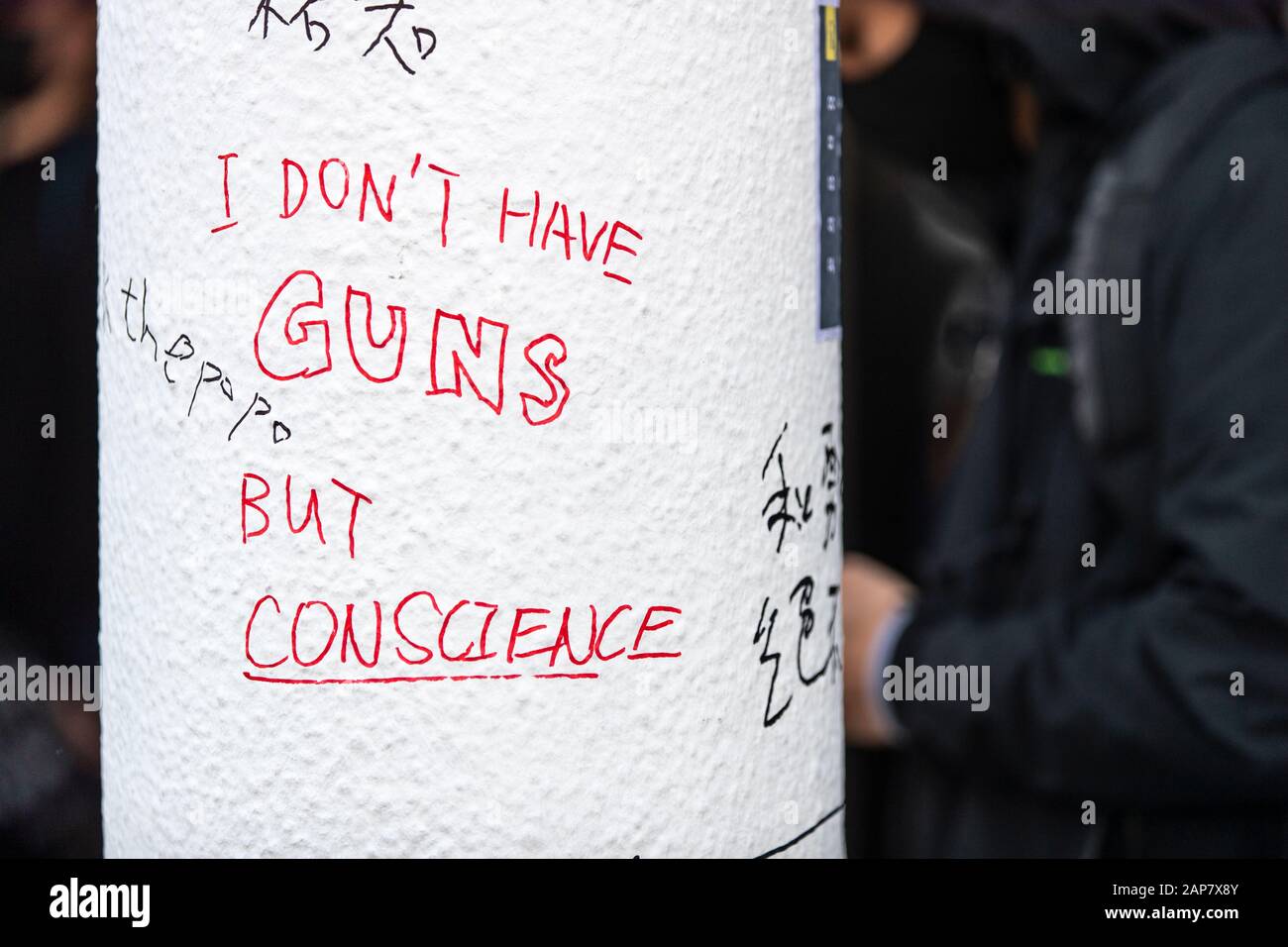 Hong Kong, China. 12th Jan, 2020. Graffiti saying, I don't have guns but conscience, during the assembly.The Hong Kong Civil Assembly Team organised a Sunday Assembly to make awareness and promote their coming march on Sunday January 19th, 2020 for Universal Siege on Communists. Credit: SOPA Images Limited/Alamy Live News Stock Photo