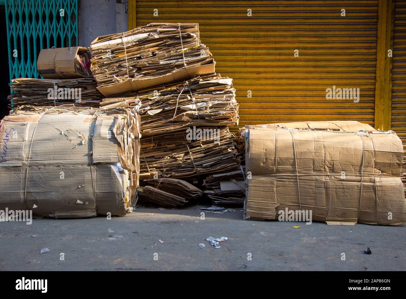 Piles of flattened carboard boxes are bundled and ready for recycling. In Kolkata (Calcutta), India. Stock Photo