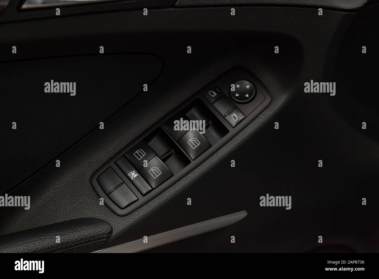 The control buttons for opening and closing windows of doors and