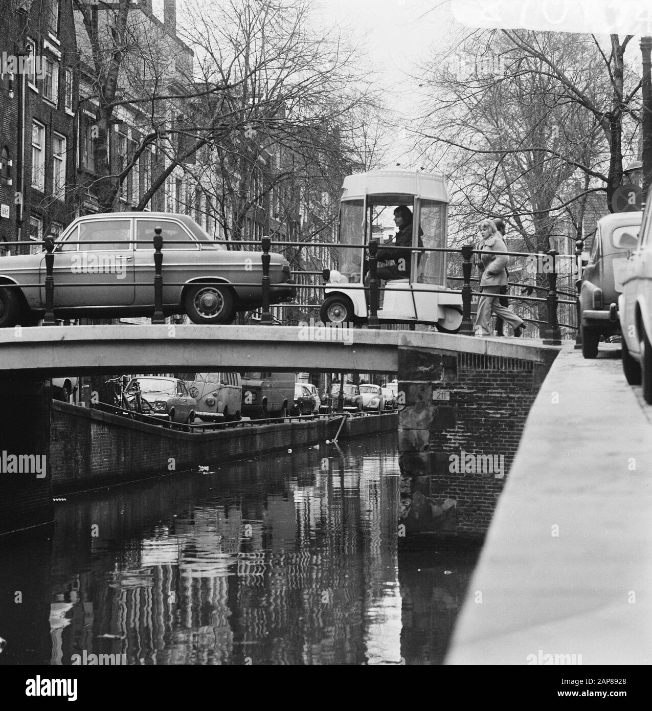 The witkar in Amsterdam Description: The witkar drives over a bridge Date: 19 February 1974 Location: Amsterdam, Noord-Holland Keywords: vehicles Stock Photo