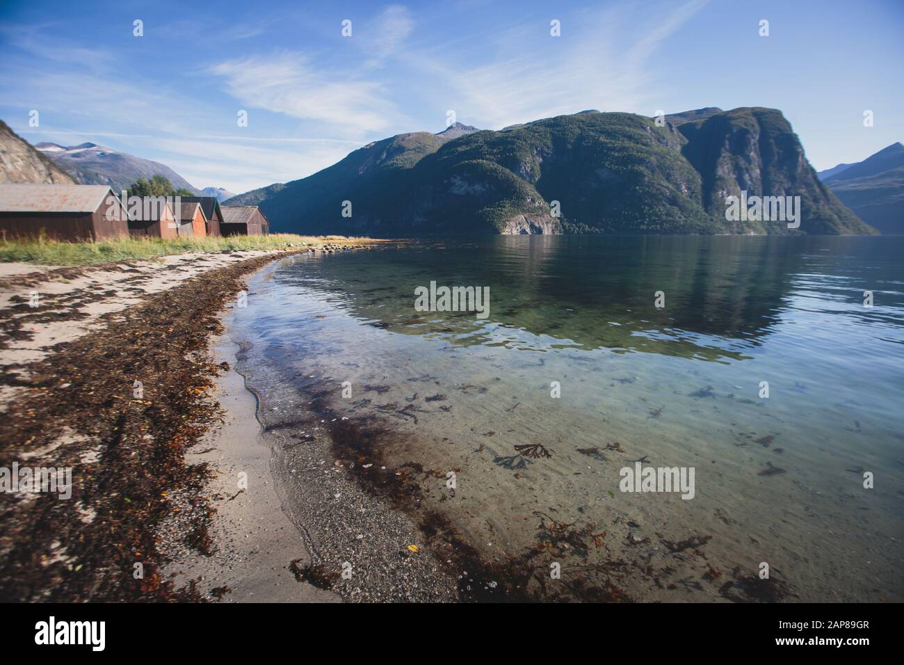 Hiking in Norway, classic norwegian scandinavian summer mountain landscape  view with mountains, fjord, lake with a blue sky, near Geirangerfjord Stock  Photo - Alamy