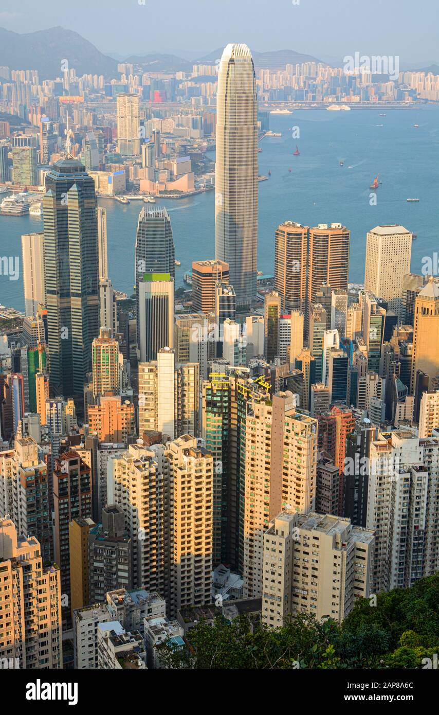 Hong Kong - March 11, 2019 - Tall skyscraper buildings in Hong Kong's busy Central District at sunset Stock Photo