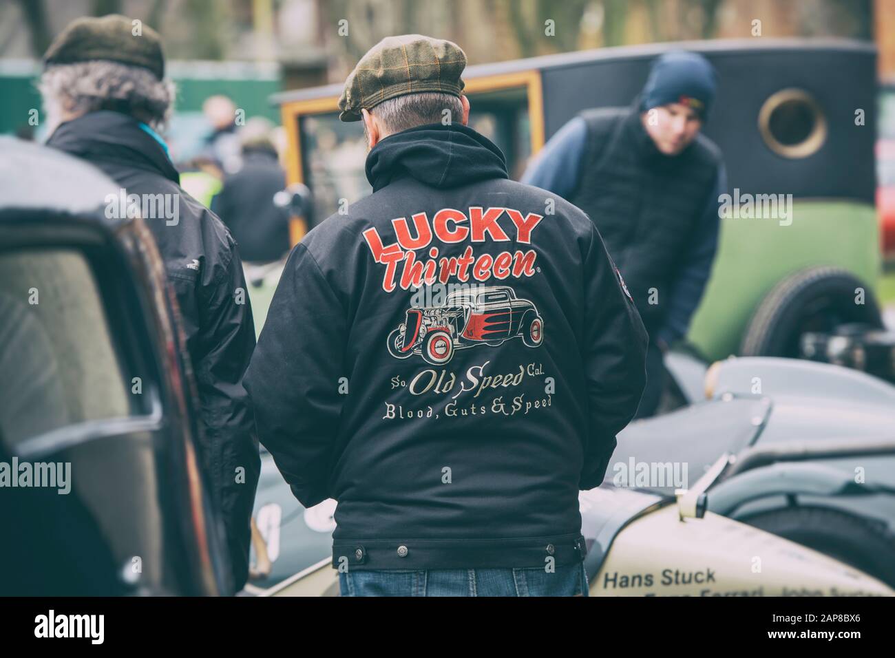 Car enthusiast wearing a Lucky thirteen old speed jacket at Bicester heritage centre sunday scramble event. Bicester, Oxfordshire, England. Stock Photo