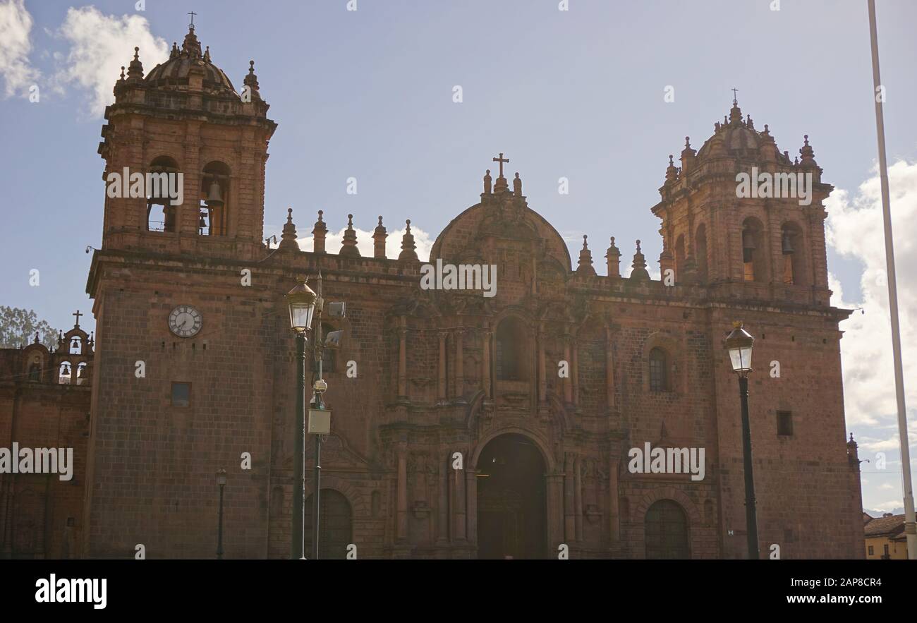 Church of the Order of Compañía de Jesús and its bell towers seen from Main Square of Cusco Peru Stock Photo