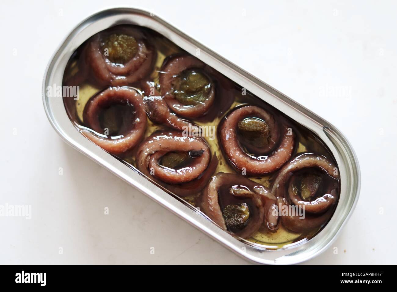 Tin of rolled up anchovies with capers Stock Photo Alamy