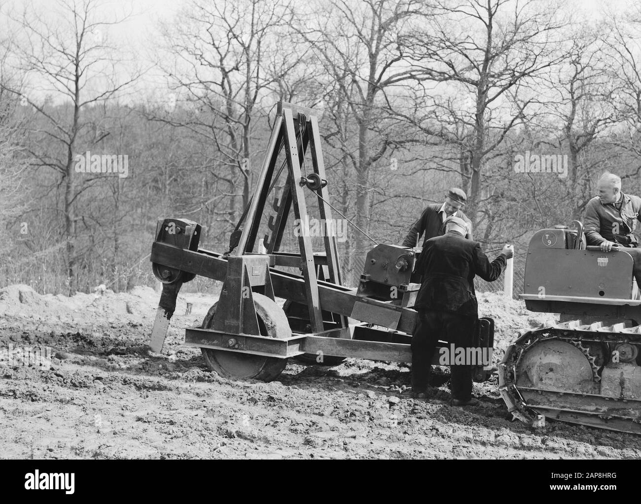 Construction of swimming pool and sports complex Beekhuizen Date: april 1953 Location: Beekhuizen, Gelderland, Velp Keywords: workers, sconces, leveling, groundworking, ground turbulents, mining Stock Photo