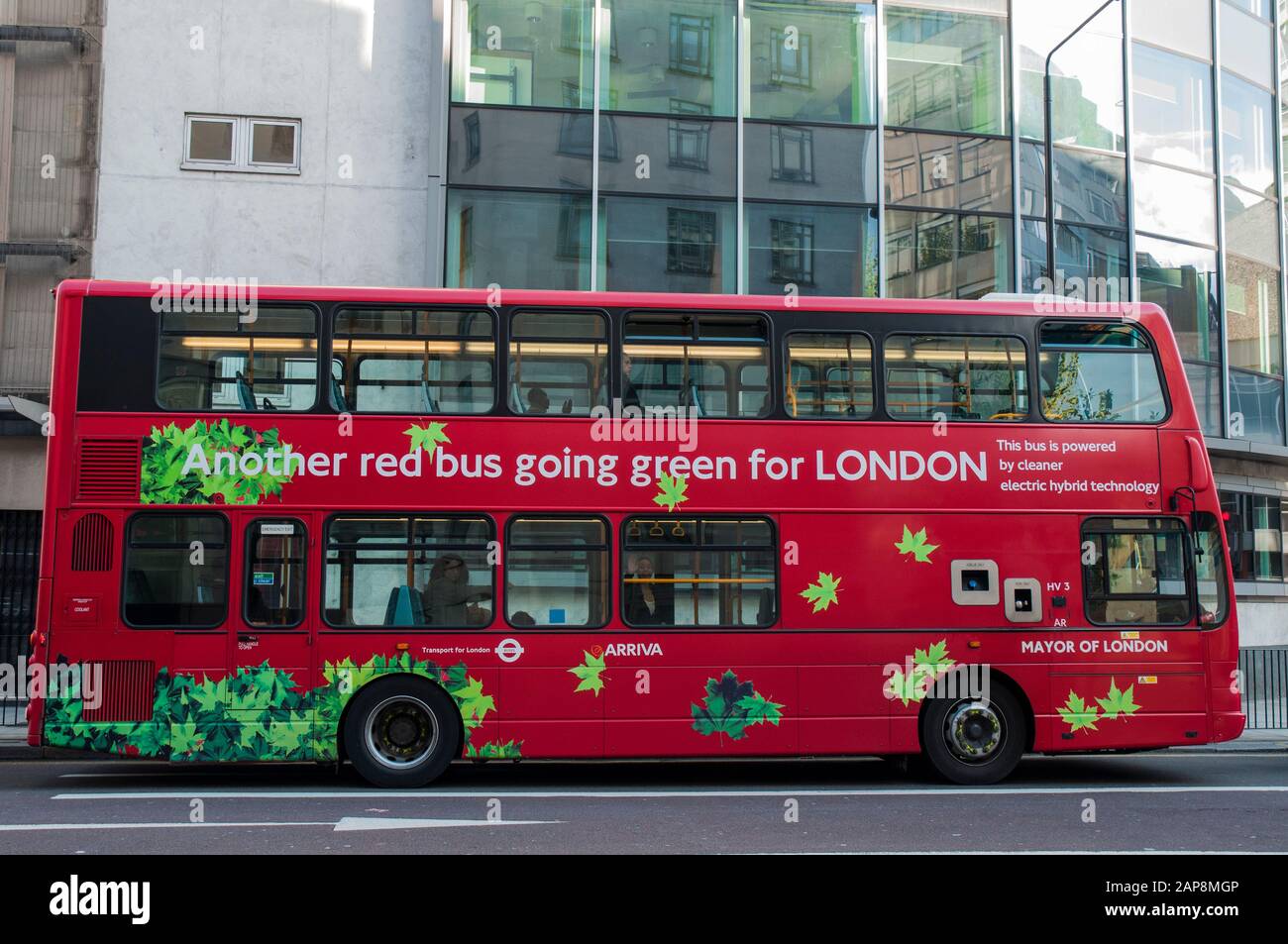 London bus bears a 'going green' advertising slogan Stock Photo