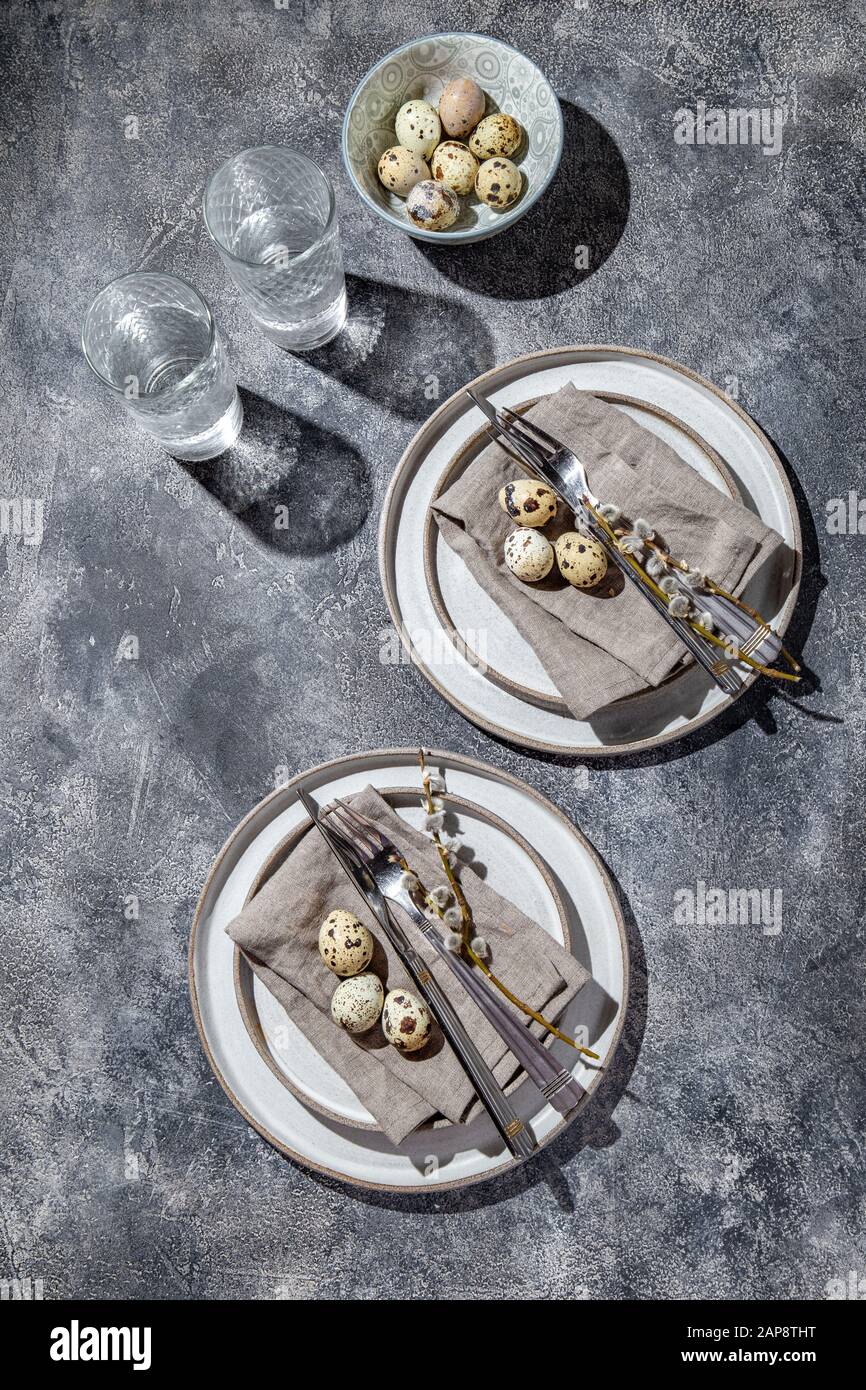 Easter festive table setting with quail eggs. top view Stock Photo