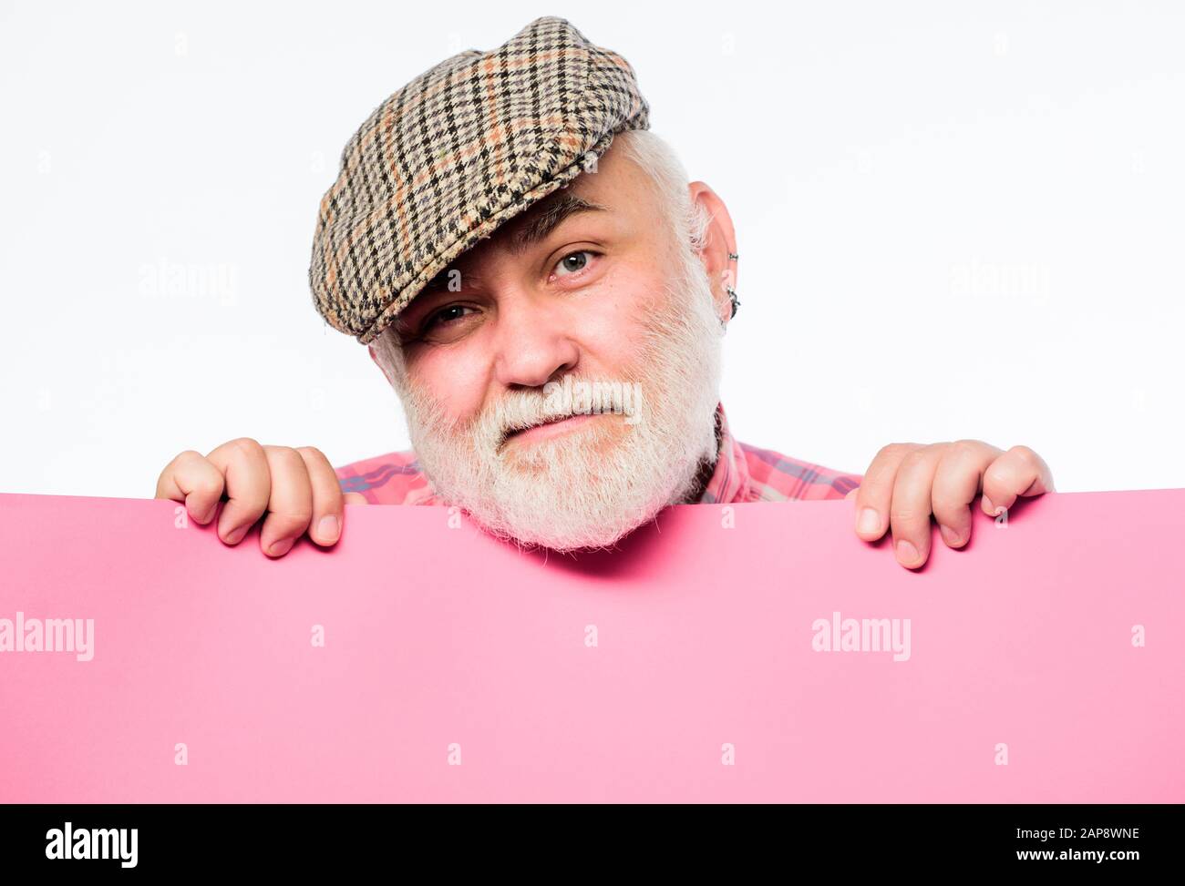 Weekend entertainment. Senior bearded man peeking out of banner place information. Public information. Advertisement elderly people. Announcement concept. Pensioner hold poster information copy space. Stock Photo