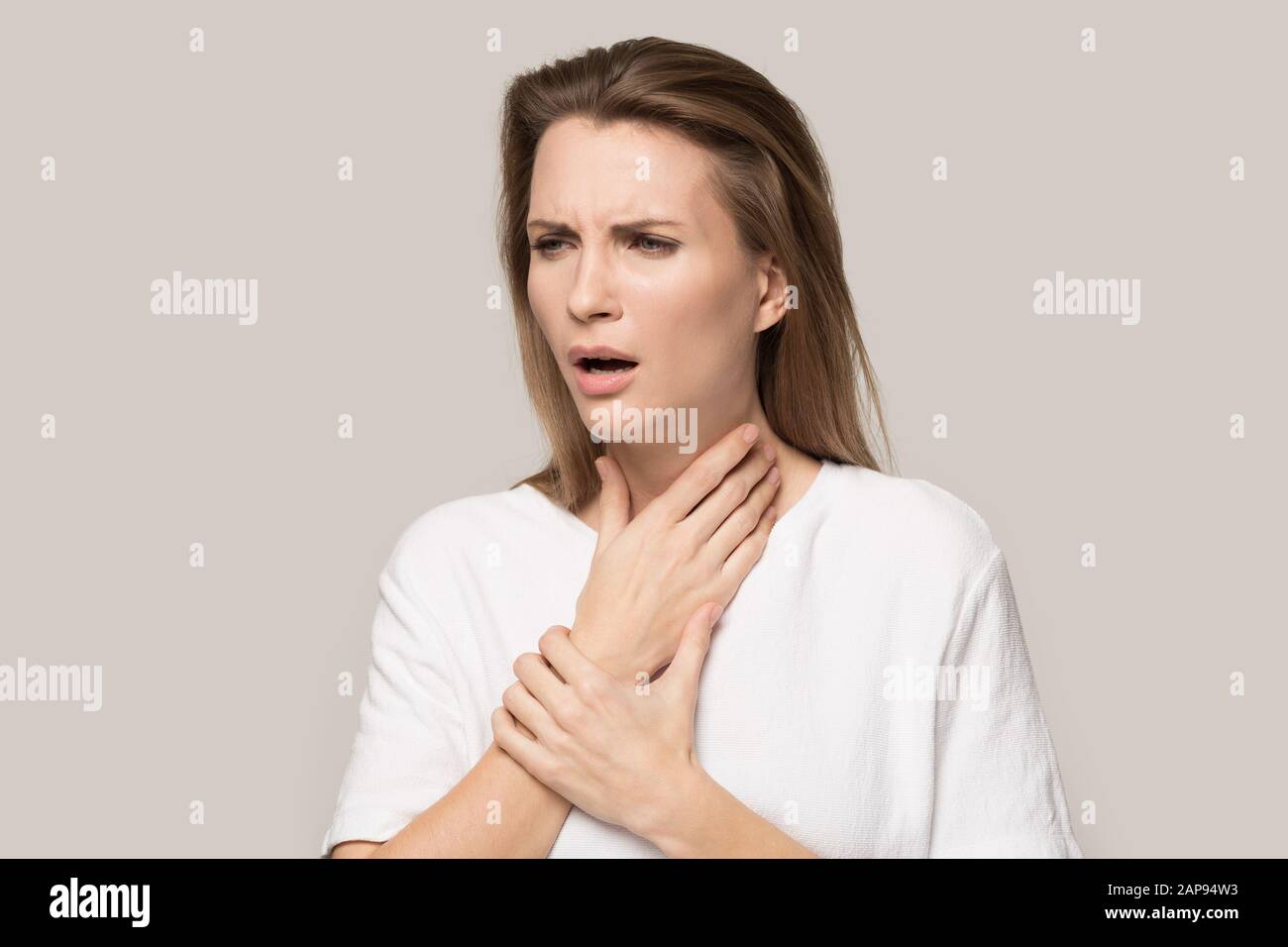 Unhealthy woman touch neck having sore throat or angina Stock Photo Alamy