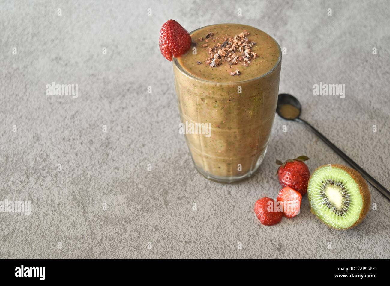 Strawberry kiwi chocolate smoothie in a mason jar, healthy organic diet food and drink, weight loss nutrition vegan alkaline vegetarian lifestyle heal Stock Photo