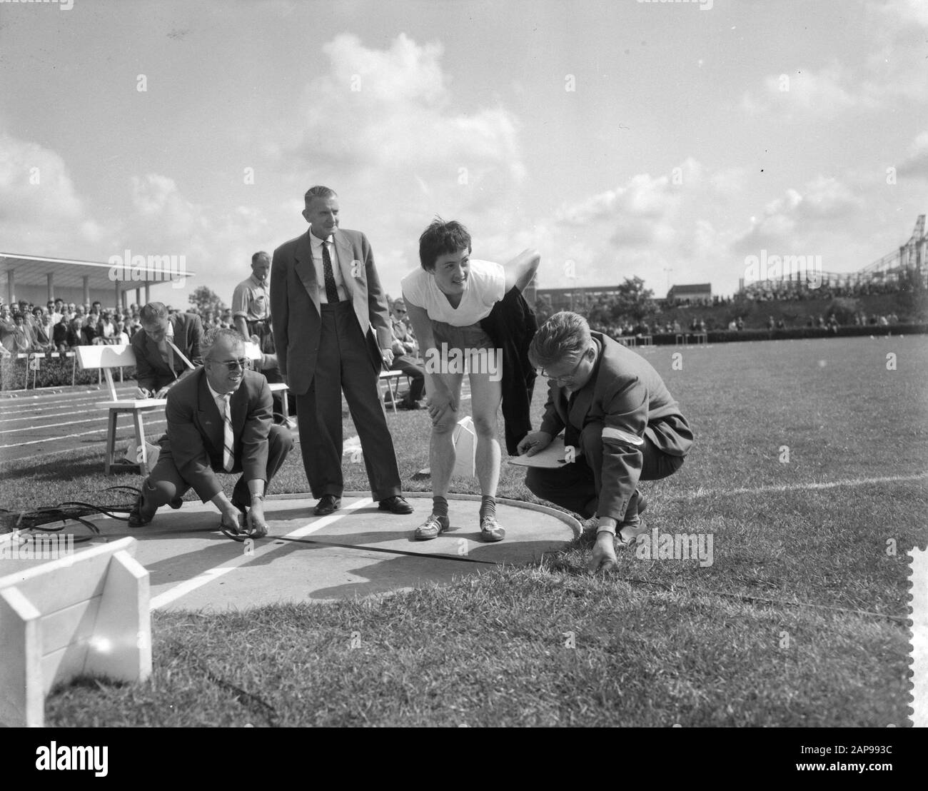 Women's athletics competitions Netherlands against Sweden in Vlaardingen, Corry Van de Bosch looks at the distance measurement Date: August 2, 1959 Stock Photo