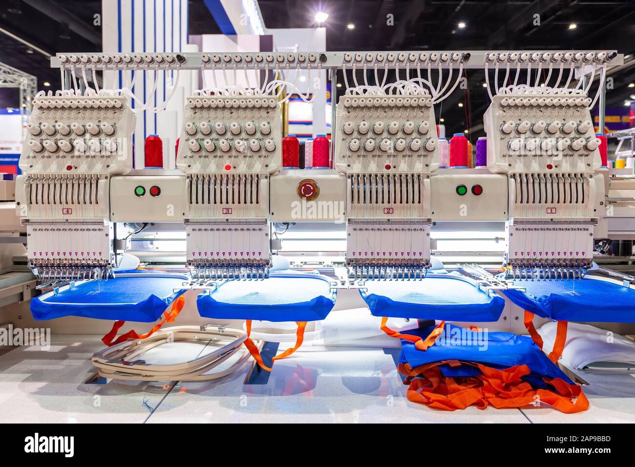 Hat sewing at modern and automatic high technology embroidery machine for  textile - clothing apparel making manufacturing process in industrial Stock  Photo