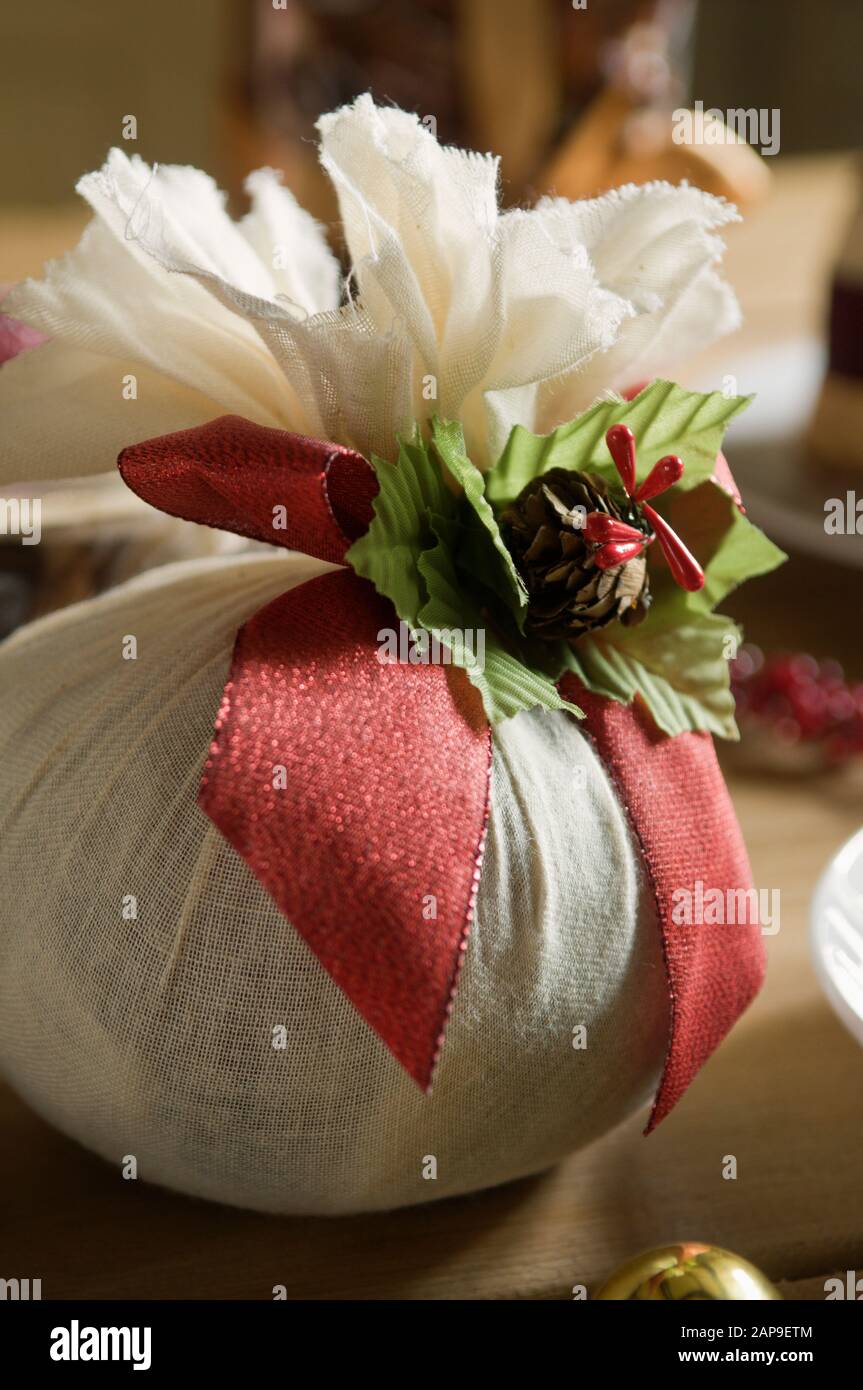 A Christmas pudding wrapped in a muslin cloth. Stock Photo