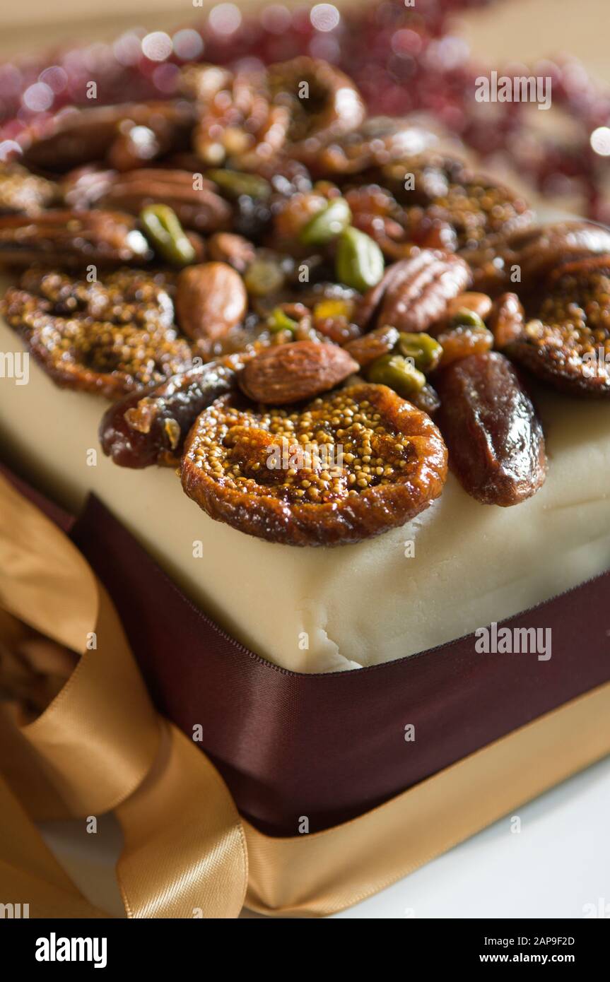 Seasonal cake with dried fruit and nut topping. Stock Photo