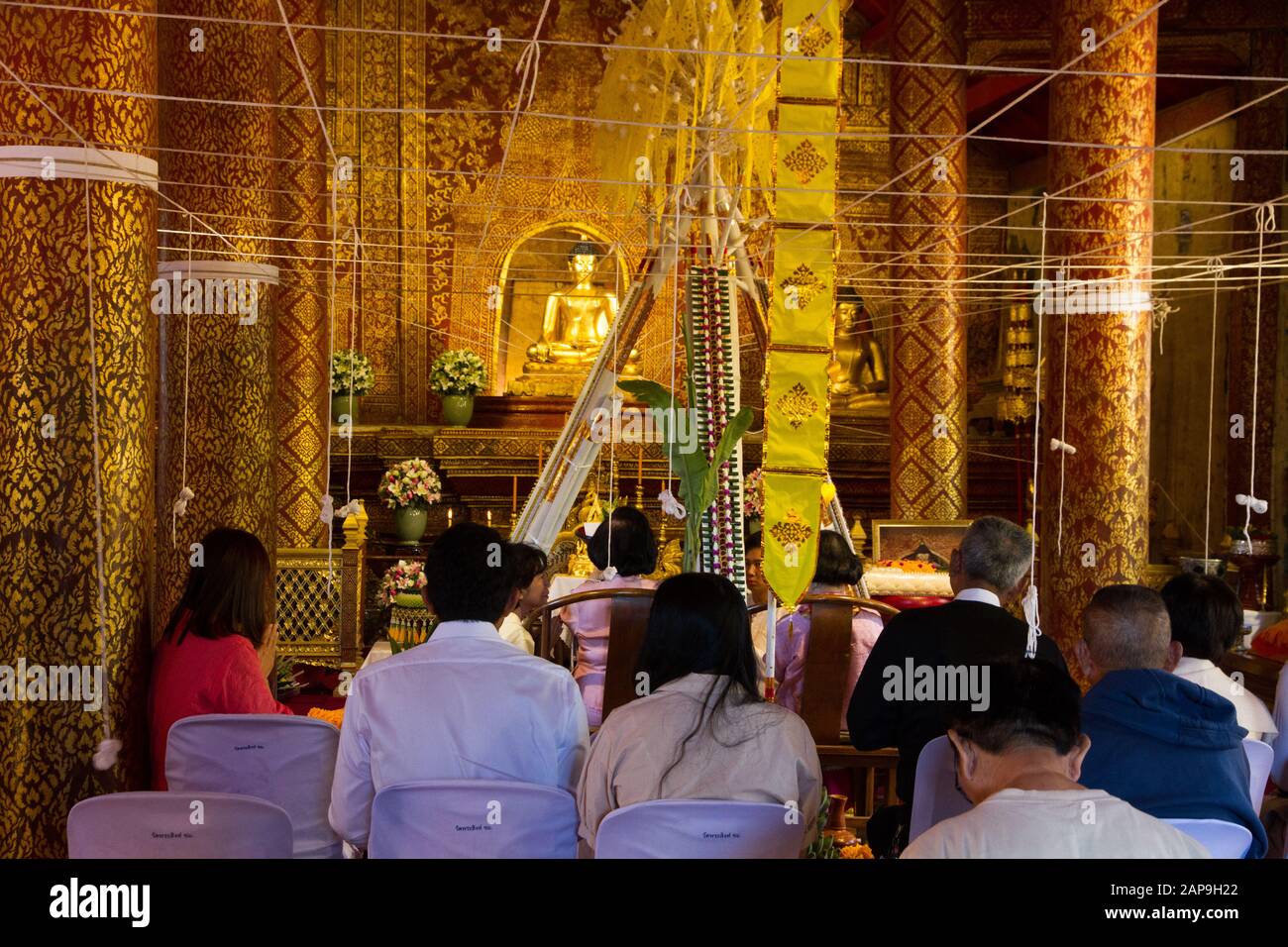 Chiang Mai Budddhist Temple interior, people Chiang Mai Thailand Stock Photo