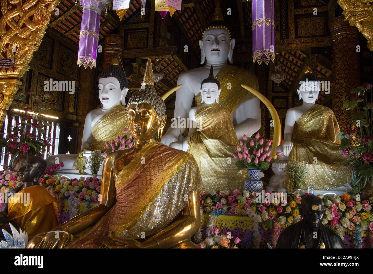 Chiang Mai Buddhist stautes in temple interior Thailand Stock Photo