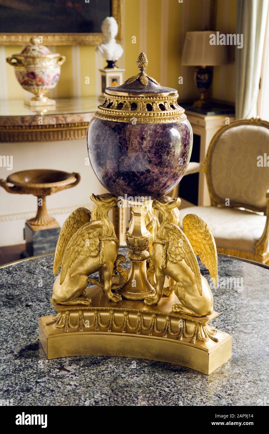 A perfume burner with a vase of blue john and ormolu supports in the form of three griffins by Matthew Boulton (1728-1802), in the Drawing Room at Hin Stock Photo