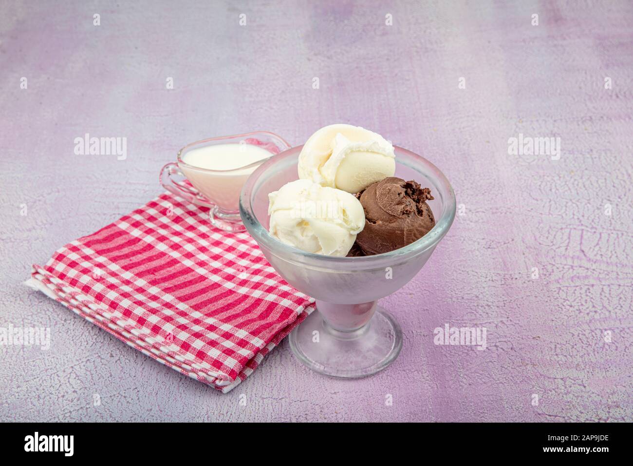 Chocolate and Vanilla ice cream scoop, scooped out of a container with