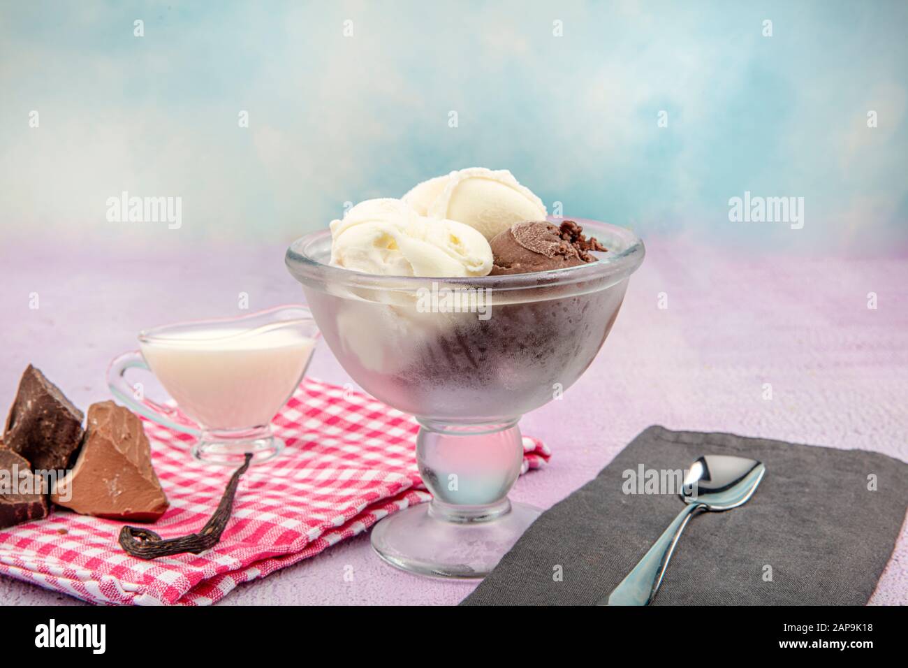 Chocolate and Vanilla ice cream scoop, scooped out of a container with
