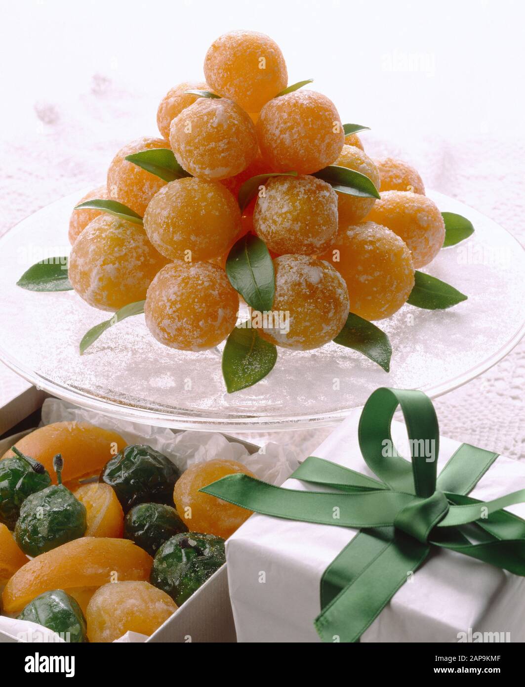 Crystallised fruit: tangerine, orange slices and plums. Stock Photo