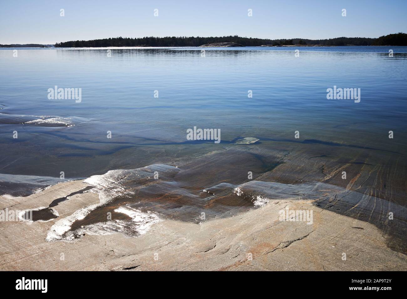 Peaceful summer landscape by the Baltic Sea in Kasnas, Kemio, Finland. Wide angle shot of the rocks on the seashore at Finnish archipelago. Stock Photo