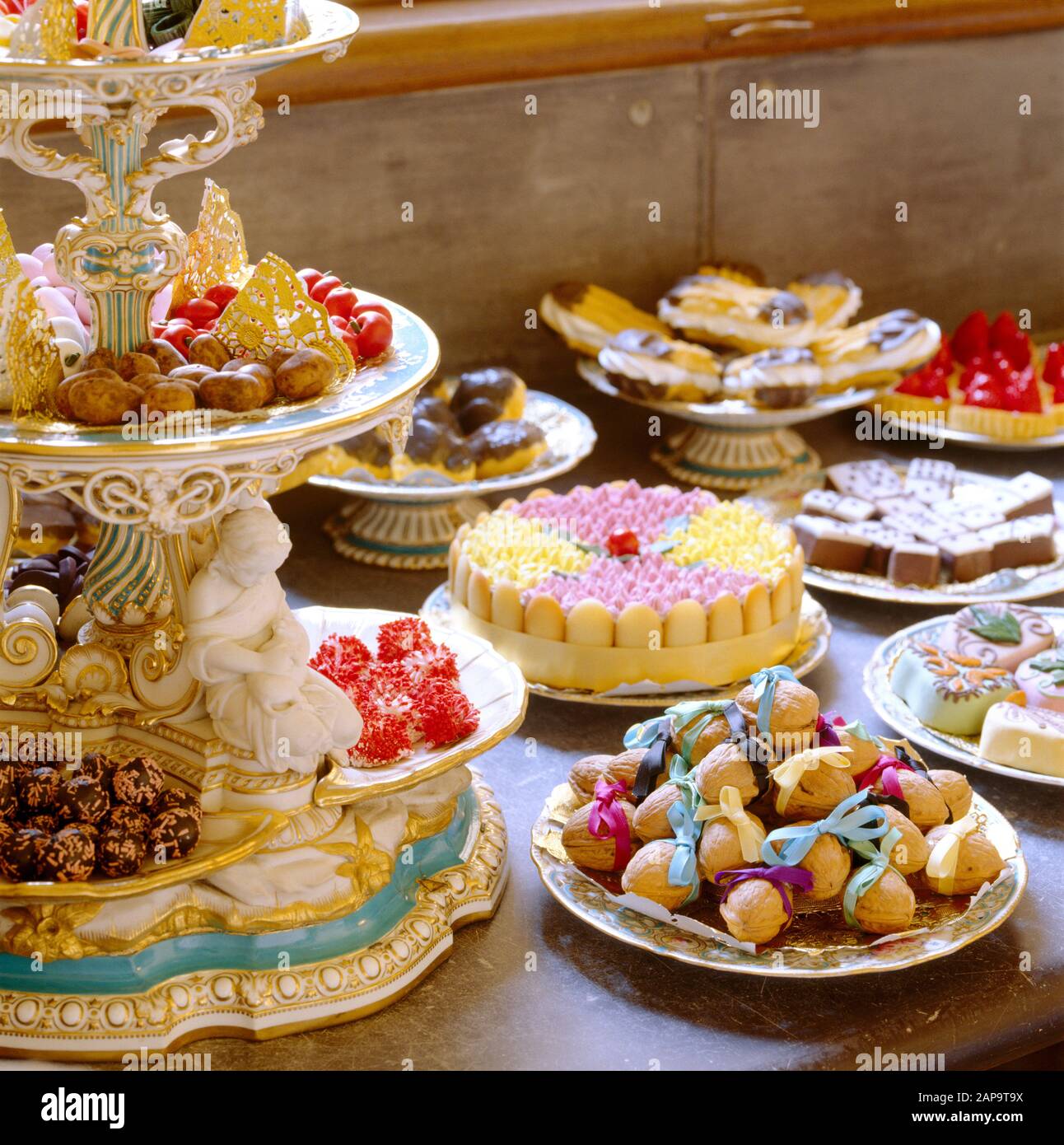Close view of desserts in the Pastry Pantry, displayed on the Minton dessert service. They include chocolate diavolini, moss biscuits, gateaux, profit Stock Photo