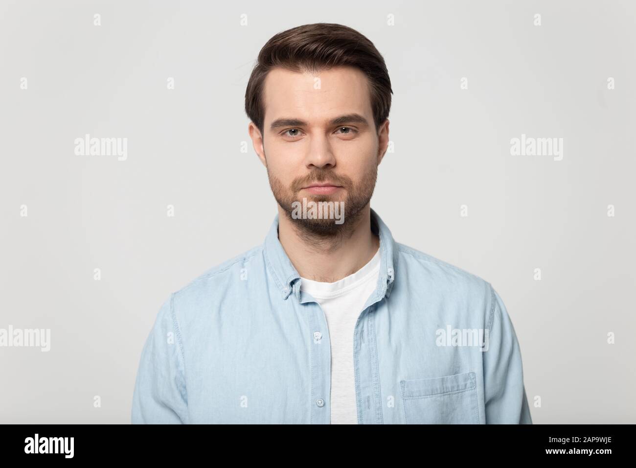 Close up head shot confident young man studio portrait. Stock Photo