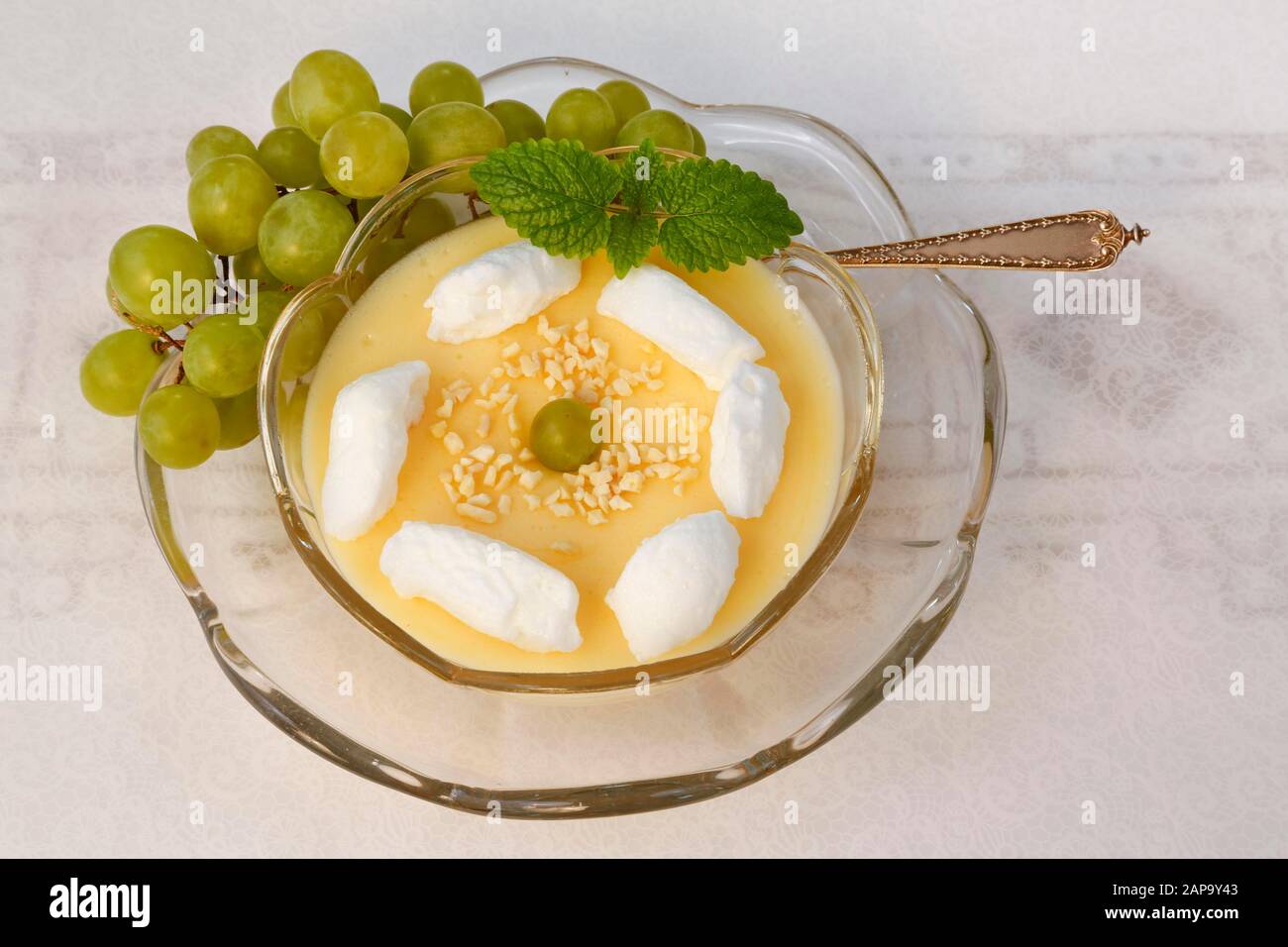 Dessert, wine cream with beaten egg white and grapes in dessert bowl, Germany Stock Photo