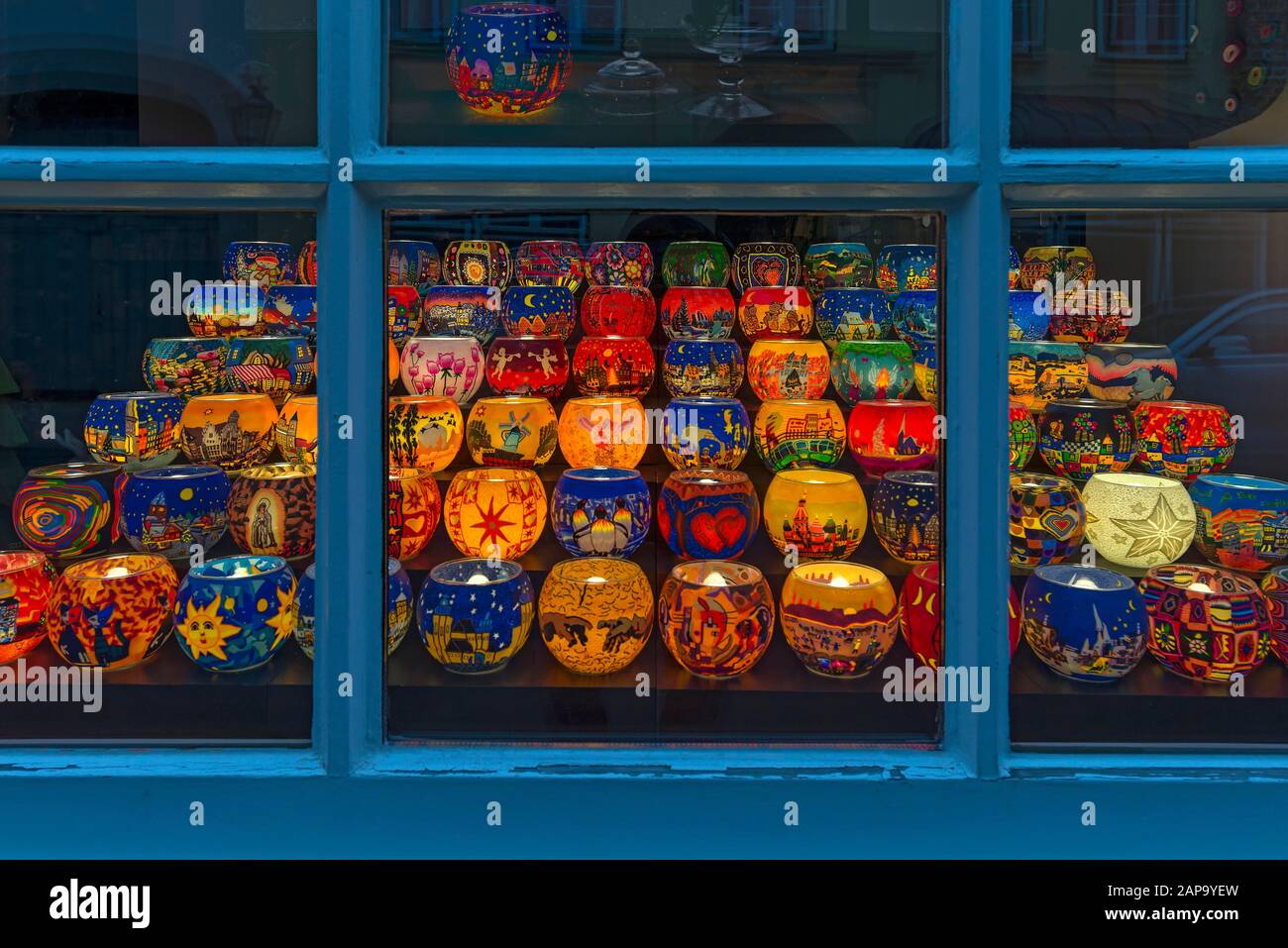 Colourful painted illuminated lanterns with Christmas motifs in a shop window, Lower Saxony, Germany Stock Photo