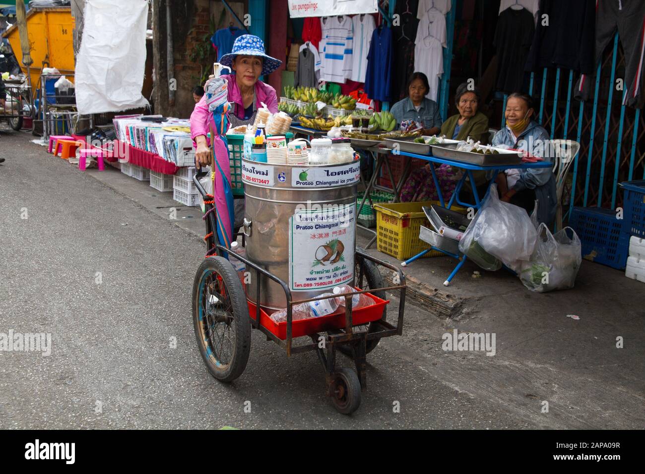 Chiang Mai woman cart seller in street market Thailand Stock Photo