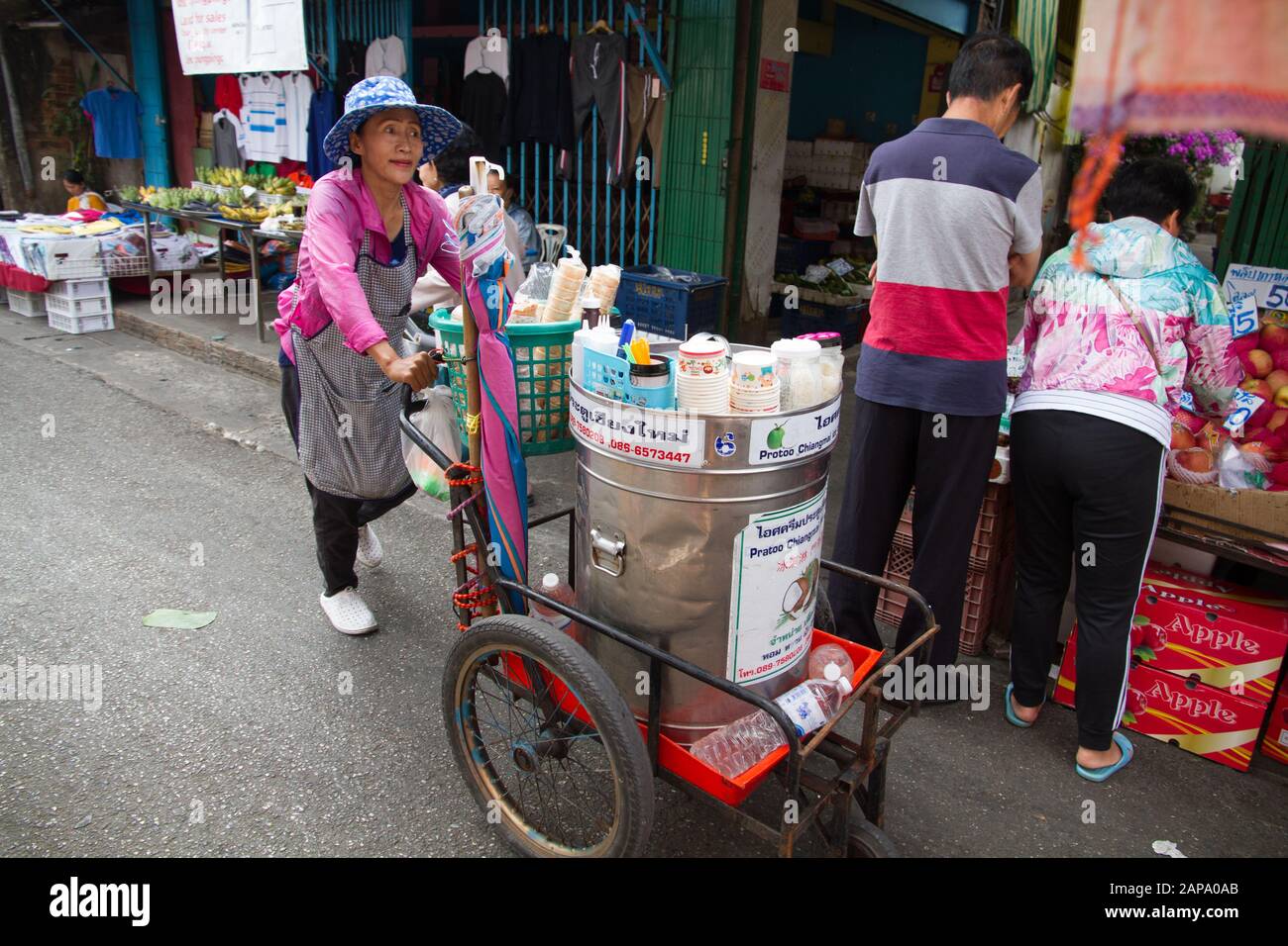 Thailand Chiang Mai woman cart seller in street market Stock Photo
