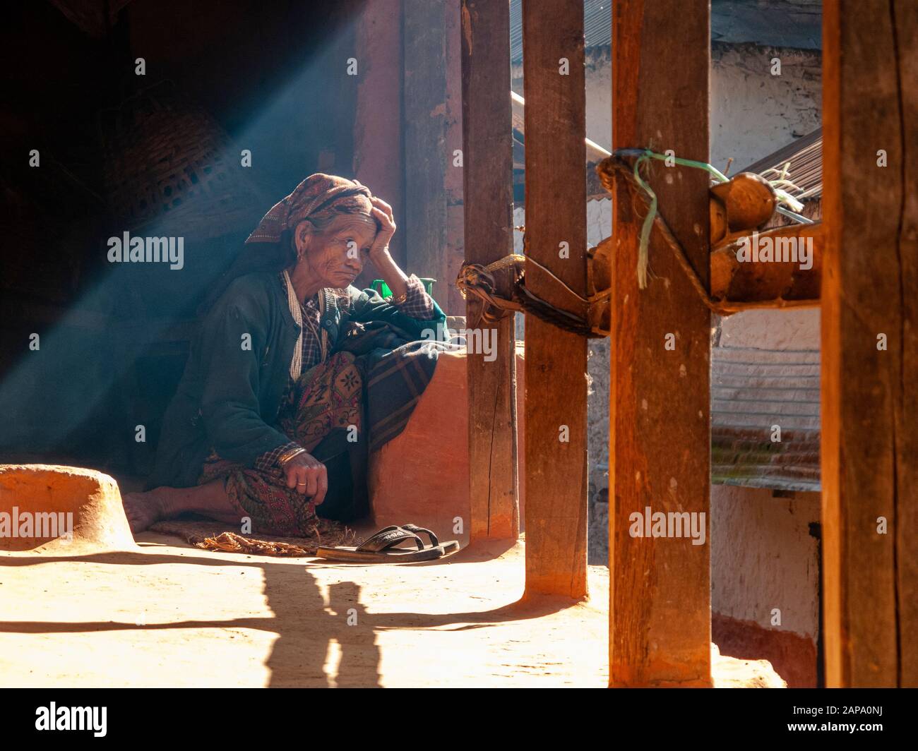 Old local woman sitting on the terrace of her house Stock Photo - Alamy