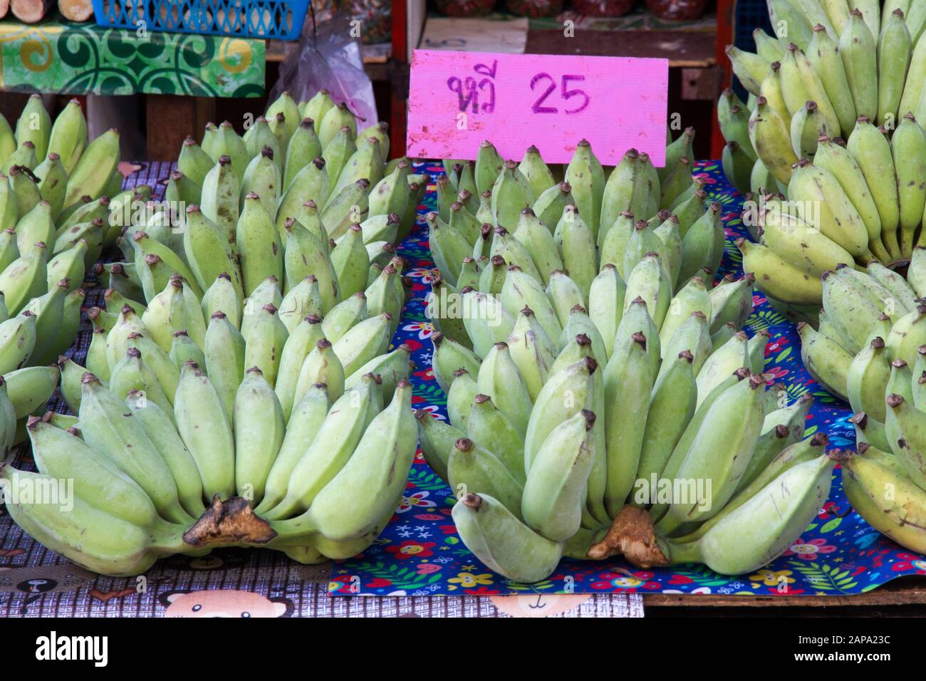 Bananas group Thailand Asia fruits in market with price tags Stock
